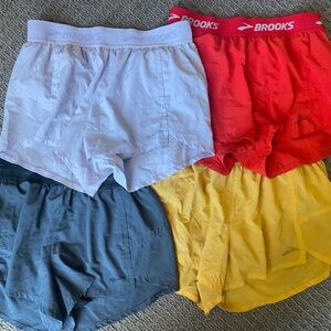 4 pairs of Brooks running shorts